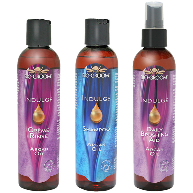 A trio of Bio-Groom's Indulge Argan Oil Line - Dog shampoo, dog conditioner, dog detangler spray.